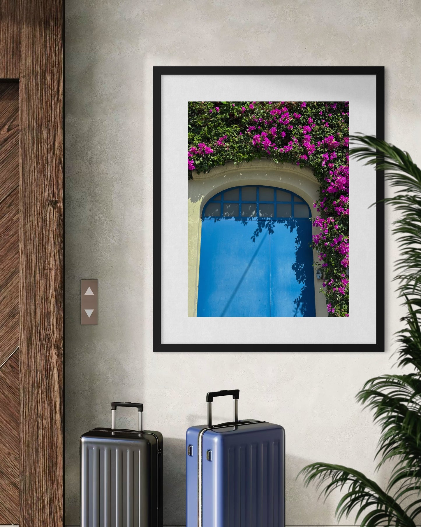 The “Charming Blue Door Framed By Bougainvillea - Fine Art Print” by Leslie Brashear Photography features a vibrant blue door and pink bougainvillea, bringing the charm of Colonia Americana to your space.