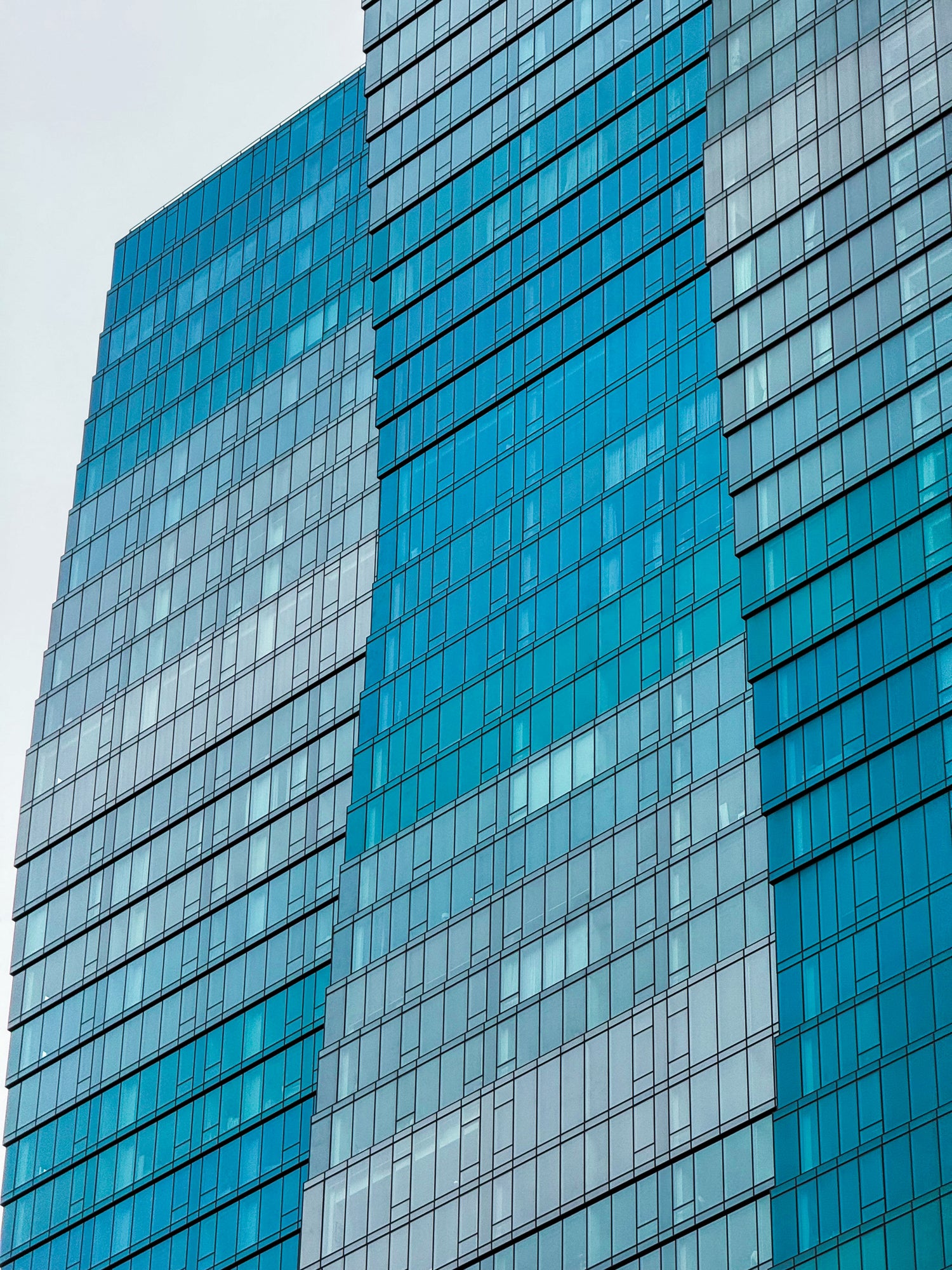 Close-up of a modern Chicago building with blue glass facade