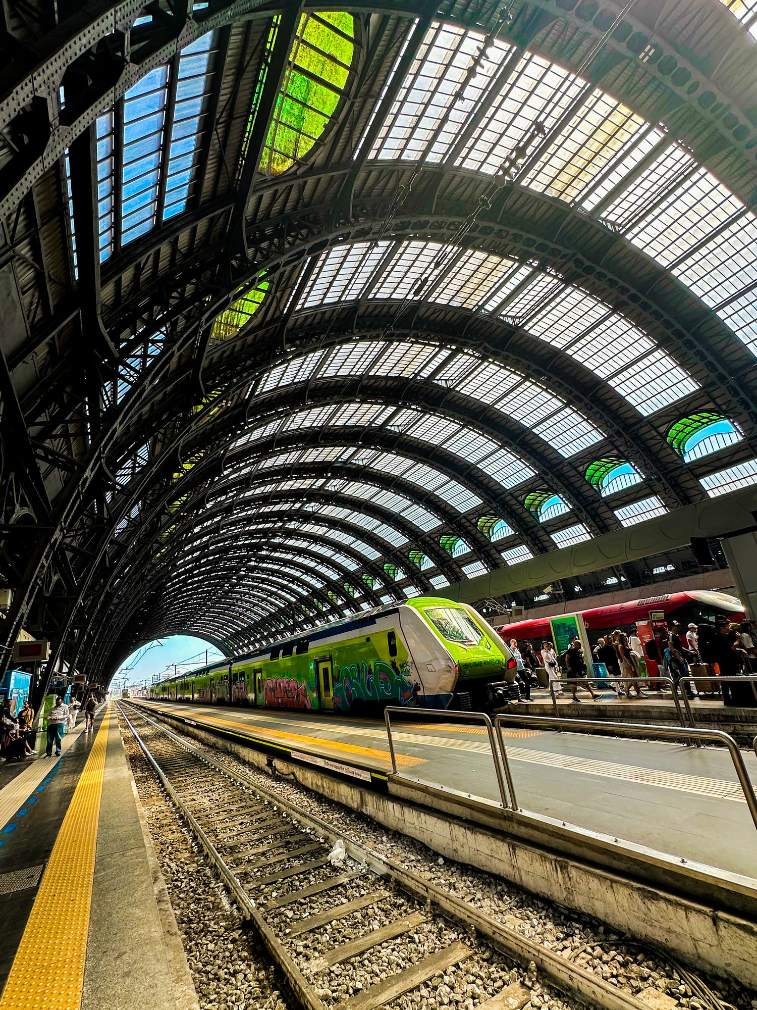 Train station in Milan, Italy with a modern train and glass roof