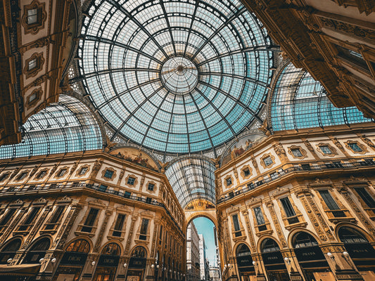 The Galleria Vittorio Emanuele II - Fine Art Print by Leslie Brashear Photography captures the landmark's ornate glass dome and lavish details, highlighting Milan’s iconic luxury architecture.